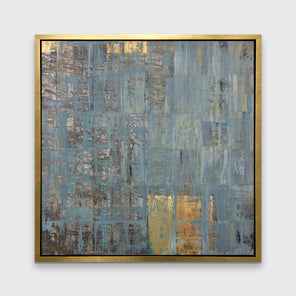 An abstract seafoam green and gold limited edition art print by Ned Martin framed in a gold frame hangs on a white wall. 