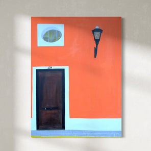 An abstract representation of a doorway with a lamp post on an orange and white building, signed by Hazal Ozturk.