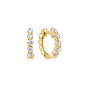 Gold hoop earrings with diamond accents on a white background