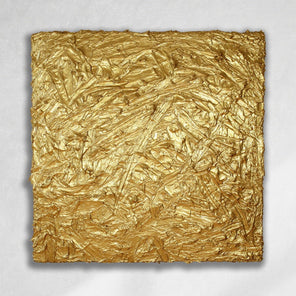 A metallic gold thick textured painting on a white wall in natural light by Teodora Guererra.