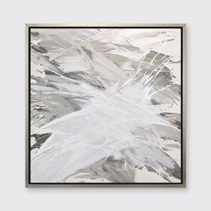A grey, beige and white abstract print in a silver floater frame hangs on a white wall.