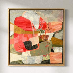A framed abstract collage artwork featuring geometric shapes in shades of red, beige, and green, with a white background hanging on a white wall.