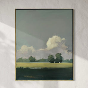 Framed painting of a landscape with trees and clouds on a gray wall.