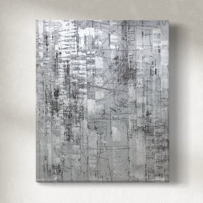 A 38" x 32" vertical abstract painting in black, white, and gray tones, displayed on a wall.