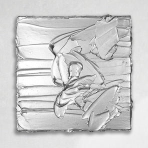 A silver metallic textured painting by Teodora Guererra hanging on a gallery wall.