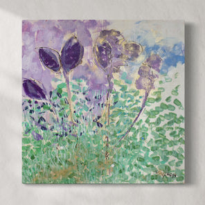 A green, blue, and violet abstracted floral painting hangs on a white wall.