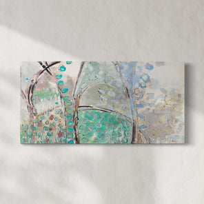 A blue, beige, and turquoise abstract painting hangs on a white wall. 