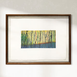 Framed artwork of a forest scene with trees in yellow and green on a white background