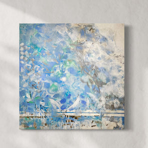 An encaustic painting with blue and turquoise marks is hung on a gallery wall. Wired and ready to hang.