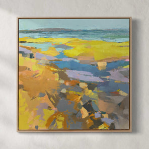 A blue and yellow abstract landscape painting hangs on a white wall. 