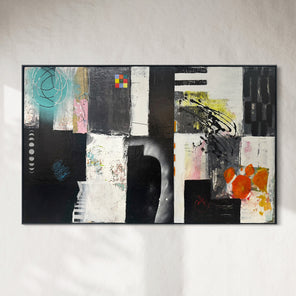 Abstract art piece with geometric shapes and colors on a white wall