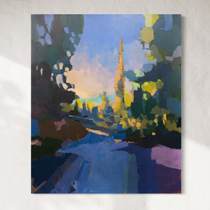 A large blue and yellow abstracted landscape painting hangs on a white wall.